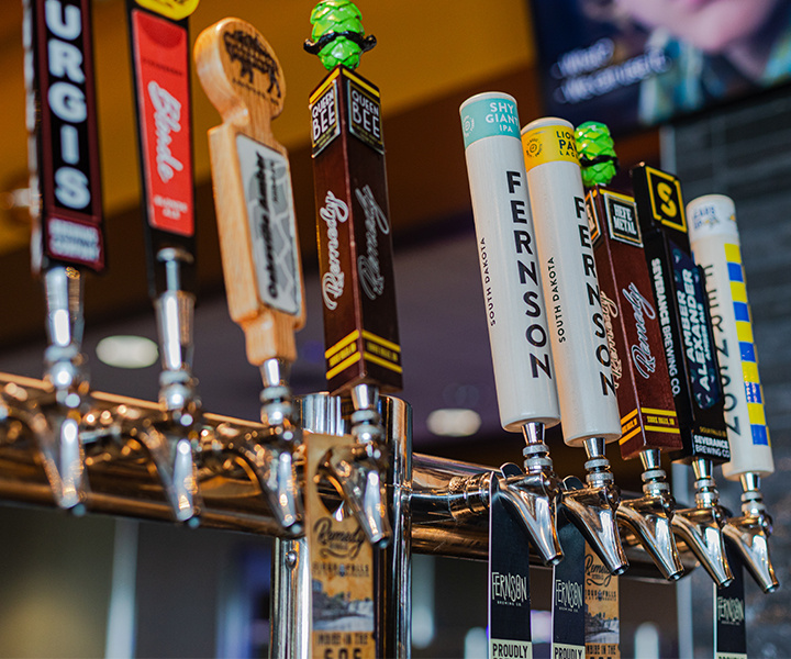 Close up of beers on tap