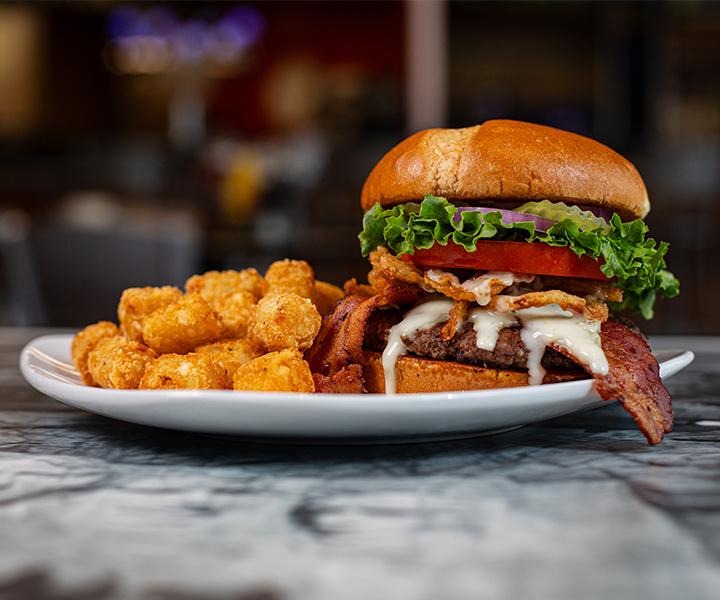 bacon and cheese burger on plate